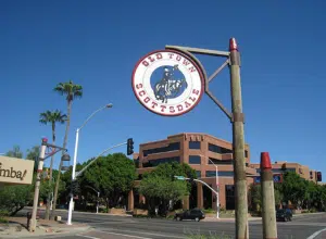 Street scene with a sign in Scottsdale, Arizona, identifying the area for our local plumbing services.