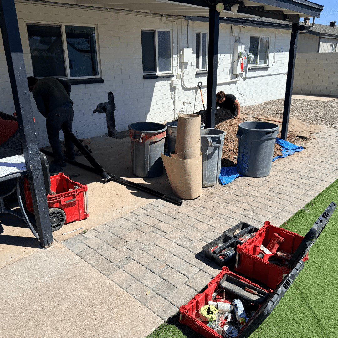Ready Rooter equipment staged on a paver patio during a service call