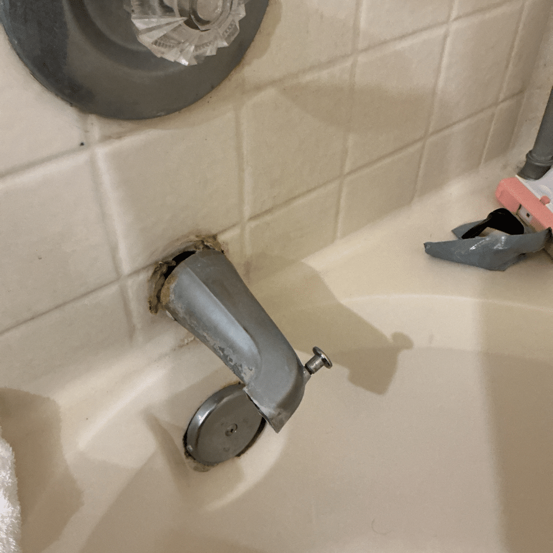 Old tub spout removed from a bathtub wall during a fixture replacement