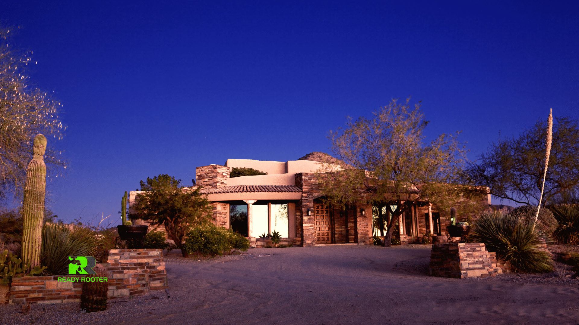 Southwestern stucco home with desert landscaping at twilight